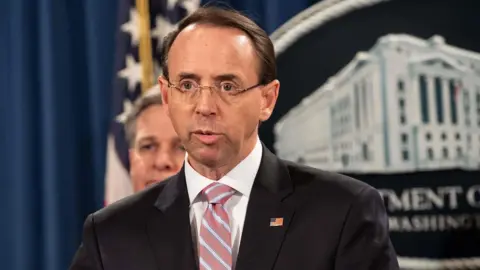 AFP US Deputy Attorney General Rod Rosenstein announces the charges