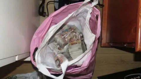 Met Police At Shtrezi's address in north London police seized £118,500 in cash as they searched his home following his arrest