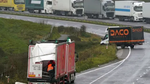 PA Media Two lorries on the A20 in Kent.