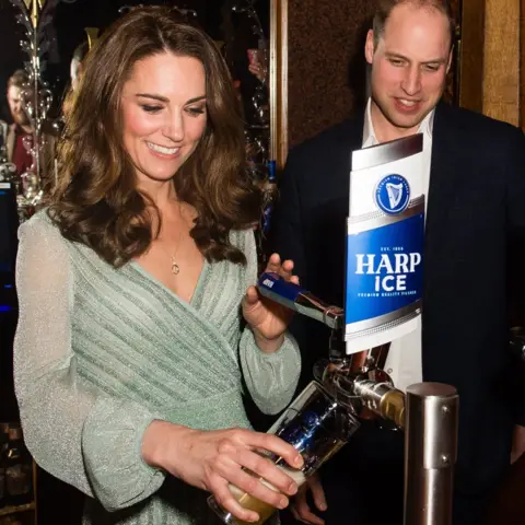 EPA The Duke and Duchess of Cambridge pull a pint as they visit the Belfast Empire Hall in Belfast