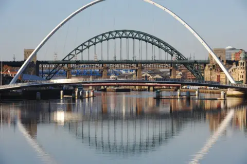 BBC Gateshead Millennium Bridge (foreground) with Tyne Bridge (background)