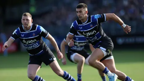 Finn Russell and Cameron Redpath running during a training session for Bath