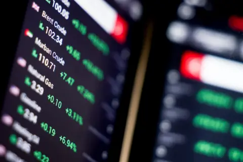  Photo by FILIP SINGER/EPA/Shutterstock (16738716e) A mobile application displays the current crude oil prices on a mobile phone screen in Berlin, Germany, 09 March 2026. Fueled by the escalating conflict in the Middle East, the international oil benchmark, Brent Crude, surged past 100 US dollars per barrel on 09 March 2026. Oil prices surge amid conflict in the Middle East, Berlin, Germany - 09 Mar 2026 A mobile application displays the current crude oil prices on a mobile phone screen in Berlin, Germany, 09 March 2026. Fueled by the escalating conflict in the Middle East, the international oil benchmark, Brent Crude, surged past 100 US dollars per barrel on 09 March 2026.