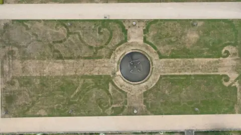 Chatsworth House The dry grass reveal swirling patterns of a 17th-century garden.