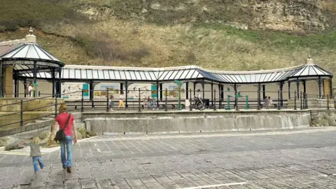 North Yorkshire Council An artist's impression of how the viewing station would look, with a covered seating area above a promenade