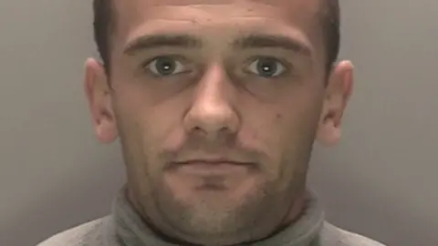 Merseyside Police Unsmiling Ryan Walsh-Westhead looks straight ahead in his police mugshot