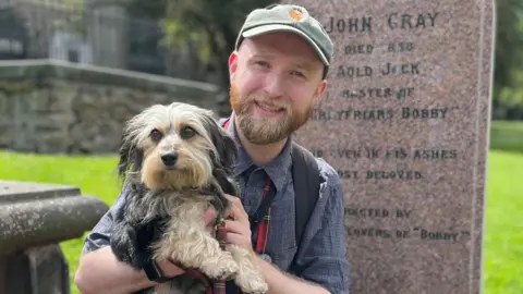 BBC Calum Ferguson with his terrier Rowie