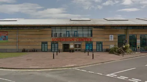 Google A Google Street image of the front of a building with "SOVEREIGN CENTRE" in red letters.