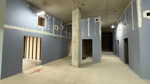 Blue coloured plaster boards, which are yet to be furnished, stand as the foundation for a new eye emergency department at the hospital.