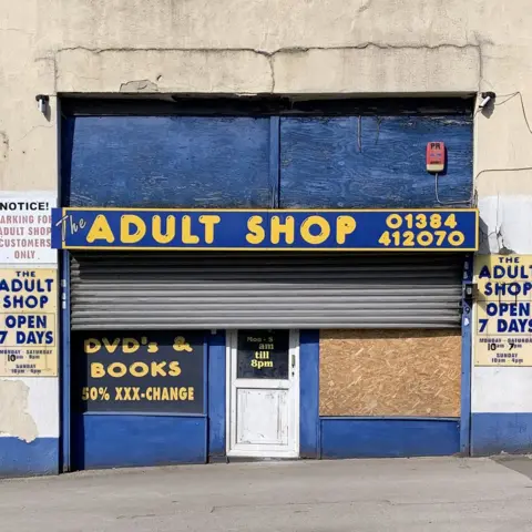 Tom Hicks Adult shop