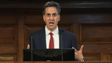 PA Media Energy Secretary Ed Miliband making a speech at the Energy UK conference