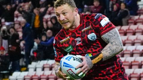 Leigh winger Josh Charnley in action