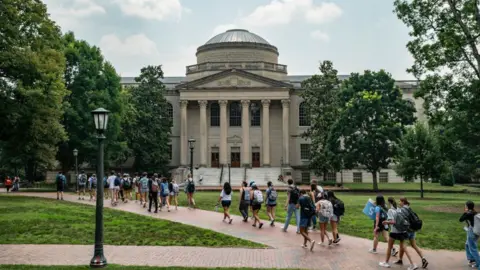  People walk on the campus of the University of North Carolina Chapel Hill on June 29, 2023 in Chapel Hill, North Carolina
