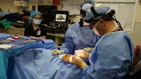 Getty Images A person has cosmetic surgery in the US