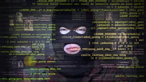 Getty Images Man in balaclava surrounded by computer code