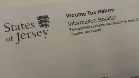 A letter with the words 'States of Jersey' on the left with a badge next to it. On the right has the words 'Income Tax Return' with 'Information Booklet' below it and 'This booklet contains information to help you'. Below that are the words 'Income Tax Return'.