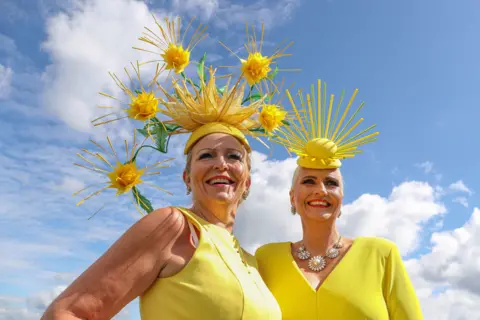 Kieran Cleeves/PA Media Racegoers during day three of the Qatar Goodwood Festival 2023 at Goodwood Racecourse, Chichester. August 3, 2023.