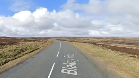 Google A road with moorland on either side of the road