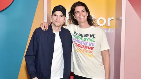 Getty Images Adam Neumann with actor Ashton Kutcher