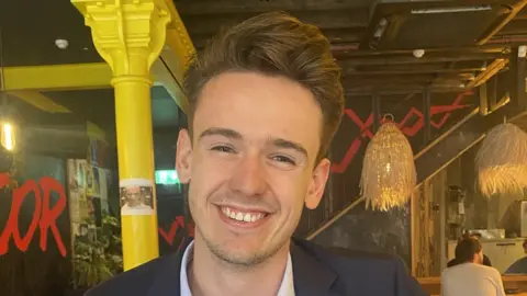 Family handout Ben Peters smiling in a bar