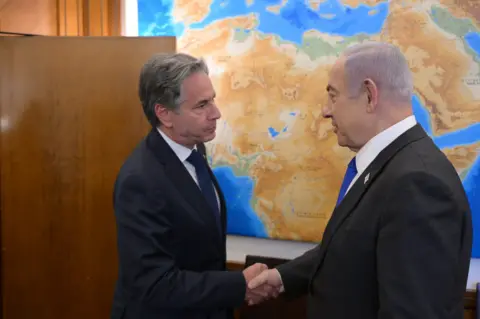 US Secretary of State Antony Blinken greets Israeli Prime Minister Benjamin Netanyahu