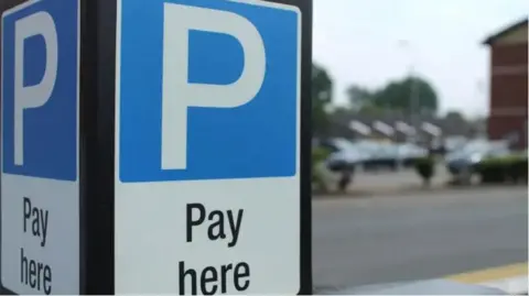 Parking sign in a car park.