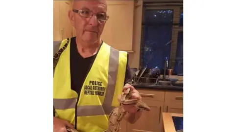 Geraint Hopkins Snake expert Geraint Hopkins with the boa constrictor
