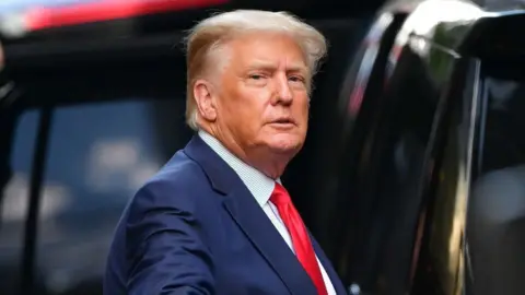 Getty Images Trump getting in a car in New York city