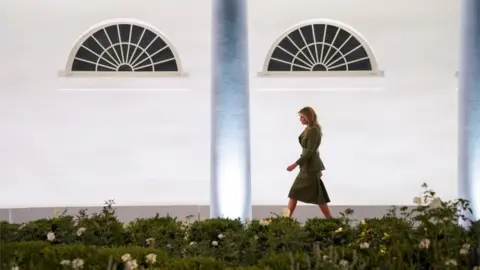 Reuters Melania walks to the podium
