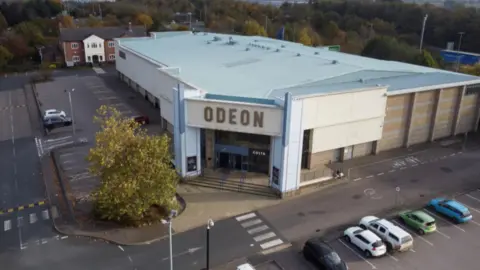 A aerial drone shot of the Odeon cinema and car park.