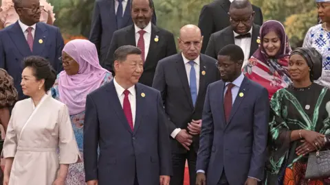 Getty Images China's President Xi Jinping and his wife Peng Liyuan get ready to pose for a group photo together with African leaders at the Focac summit in Beijing, China - 4 September 2024