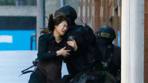 Reuters A hostages escapes from the Sydney siege
