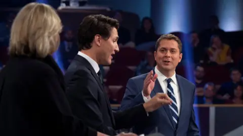 Pool via Reuters Conservative leader Andrew Scheer debating Liberal leader Justin Trudeau