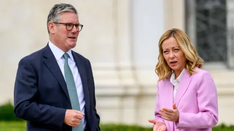 Getty Images Sir Keir Starmer gathering  Italian PM Georgia Meloni.