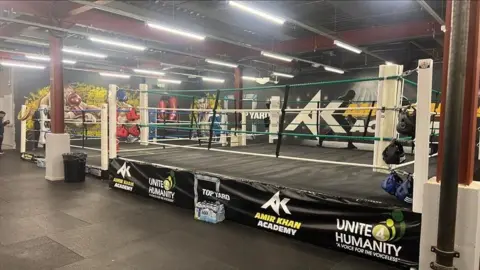Richard Knights/BBC Brand new boxing ring facilities, with poles and tiled floor