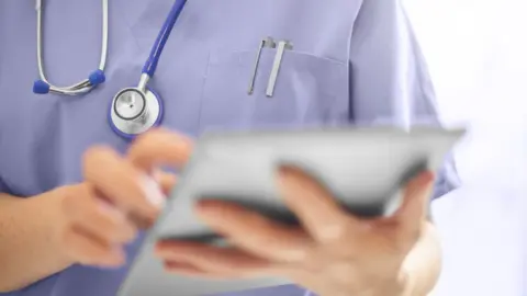 Getty Images Doctor using a tablet computer