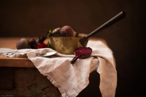 Sarah Blandford Beetroots in a pan on white fabric