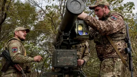 EPA Ukrainian servicemen install a 'Skif' anti-tank guided missile (ATGM) system at an undisclosed location in the Zaporizhzhia region