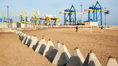 Getty Images Concrete blocks on a beach to block vehicles from the Azov Sea to the main road outside Mariupol port, 17 February