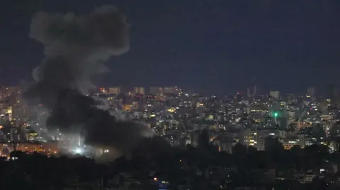 Smoke rises over Lebanon's capital Beirut after reported Israeli air strikes. Photo: 23 November 2024