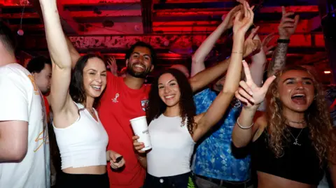 PA Media Fans watching England v Mexico