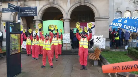 Stephen Sumner Protesters holding up signs