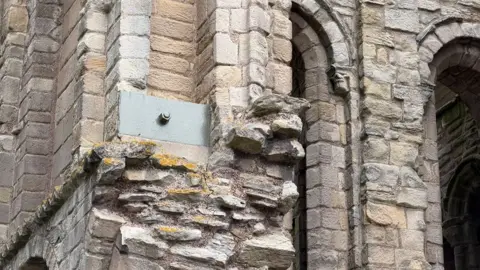 A metal block in the brickwork of Kelso Abbey to help hold it in place