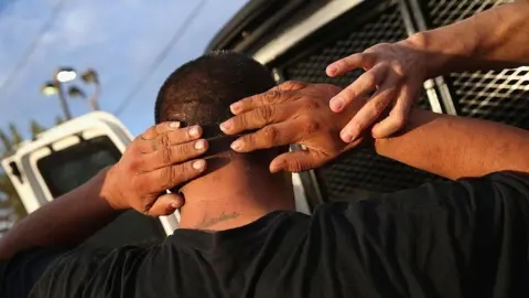 Getty Images ICE agents detaining an immigrant in California in 2015. 