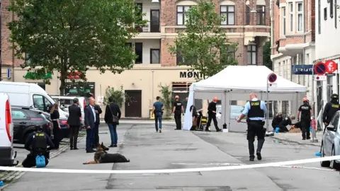 Reuters Danish police technicians inspect the scene outside a local police station, following an explosion in Copenhagen, Denmark August 10, 2019