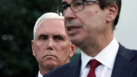 Getty Images Mike Pence and Steven Mnuchin speaks to media outside White House