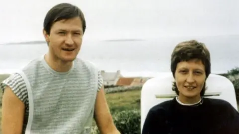 Presseye Pat and Geraldine Finucane pictured on holiday with the sea in the background