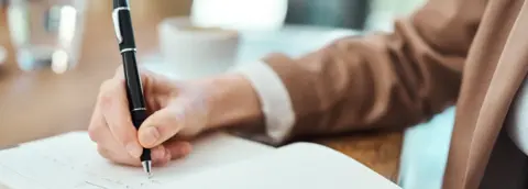 Getty Images Person writing