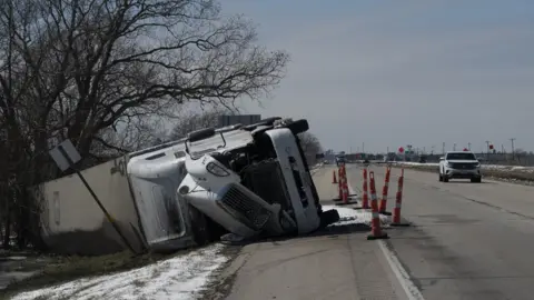 Getty Images A large trailer truck is seen flipped sideways on highway 59 in Texas