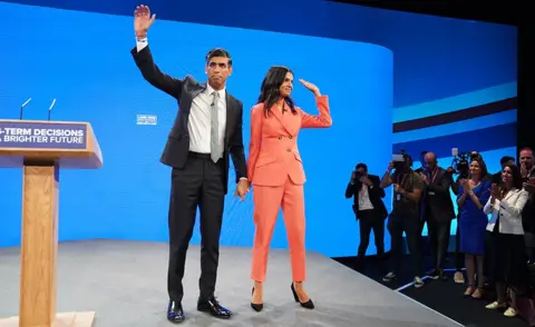 PA Media Rishi and Akshata Sunak